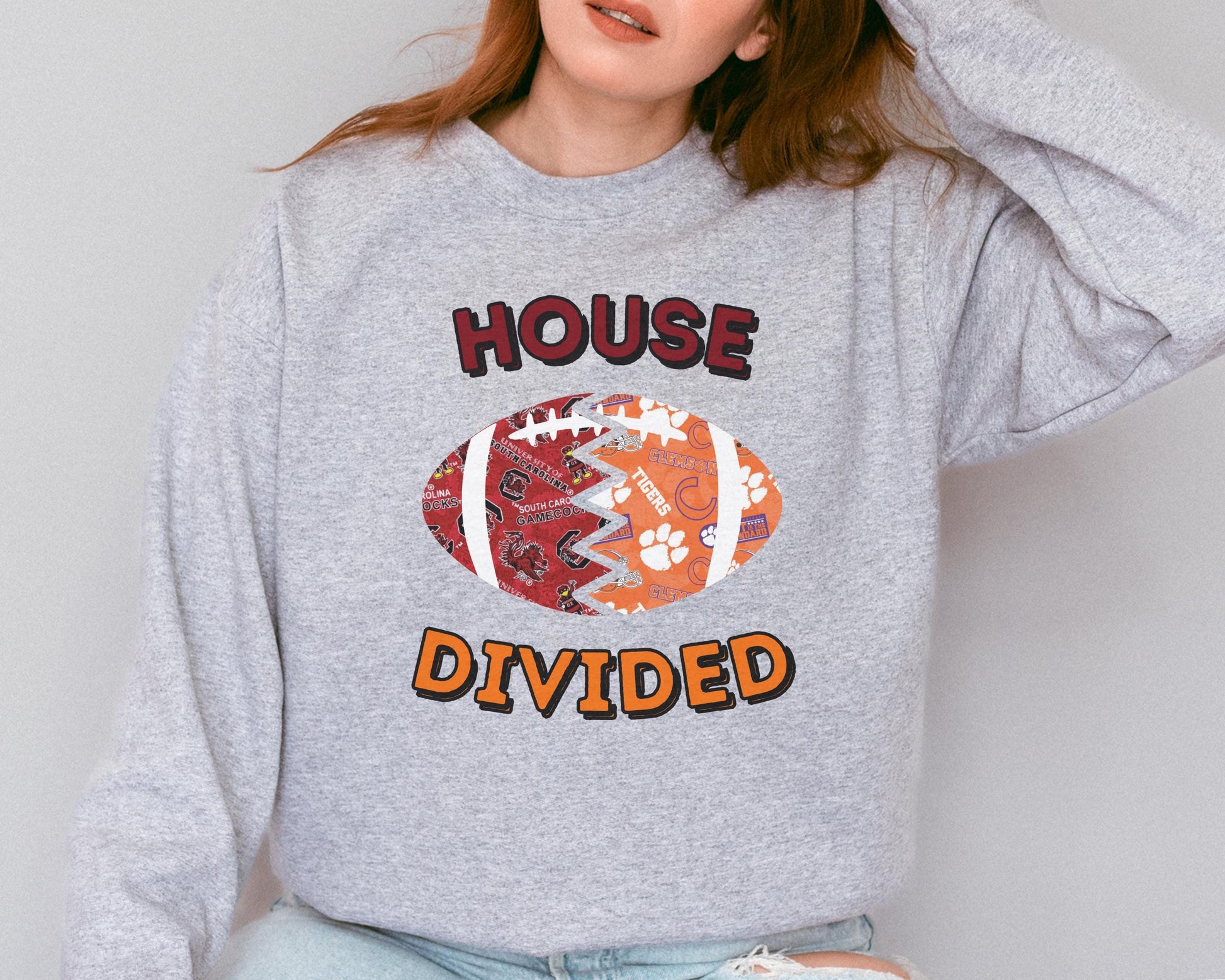 a woman wearing a sweatshirt that says house divided