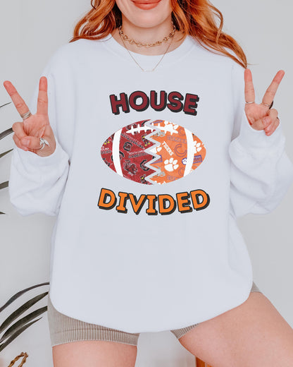 a woman wearing a white sweatshirt that says house divided